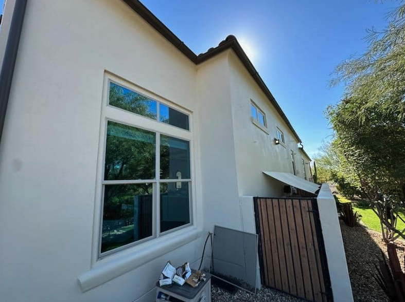 Double-hung windows cleaned on a two-story Phoenix stucco home