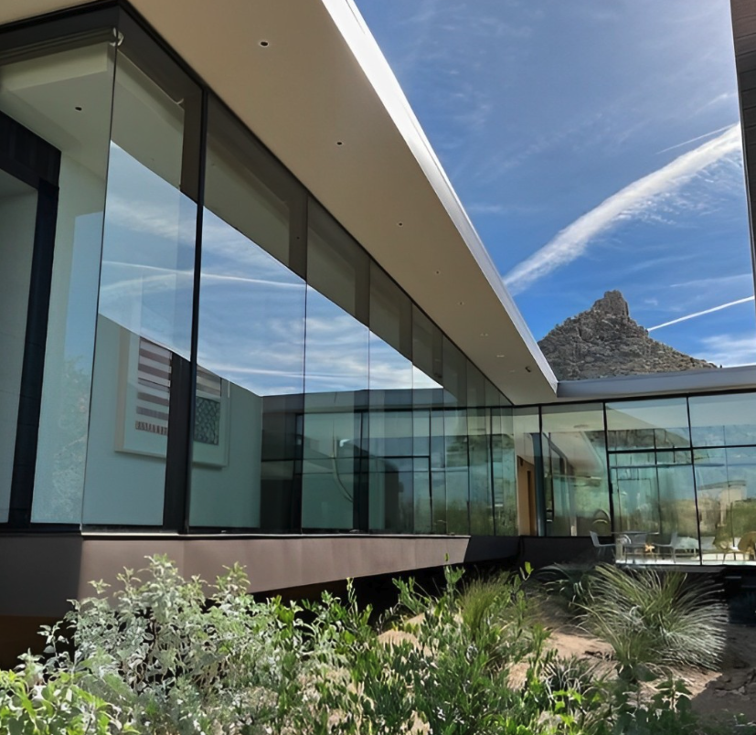 Modern desert home with freshly cleaned floor-to-ceiling windows